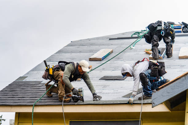 Professional Storm Damage Roof Repair technician working in Hillburn, NY